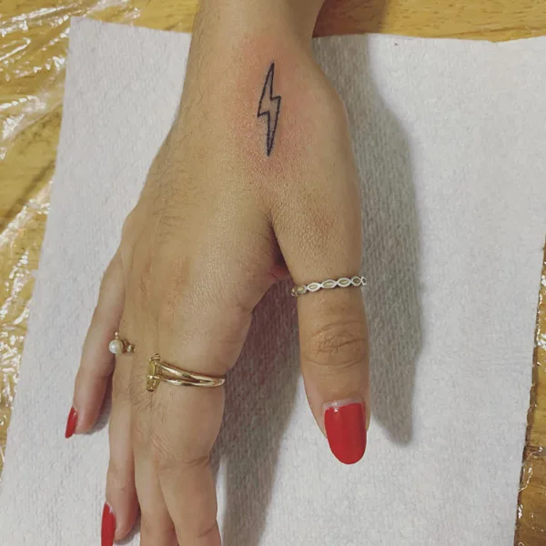 Lightning bolt hand tattoo