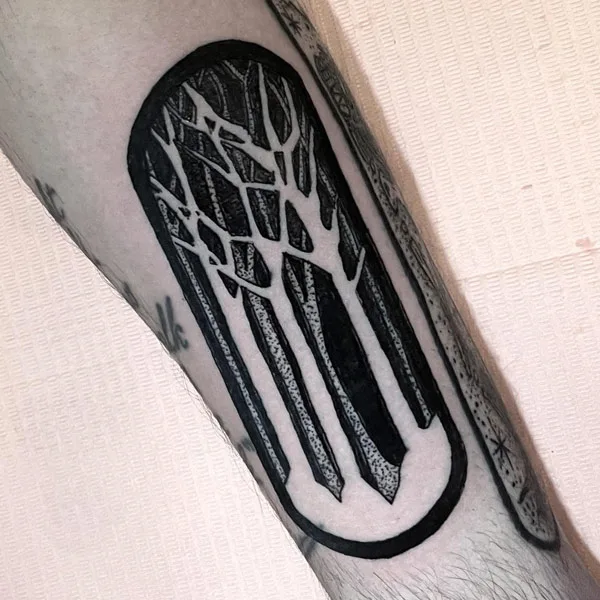 Negative Space Forest Tattoo