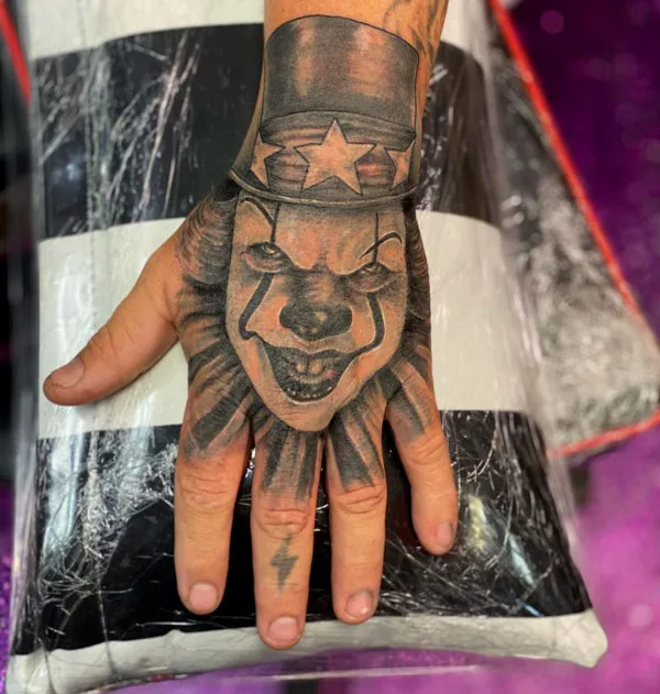 Pennywise tattoo on hand
