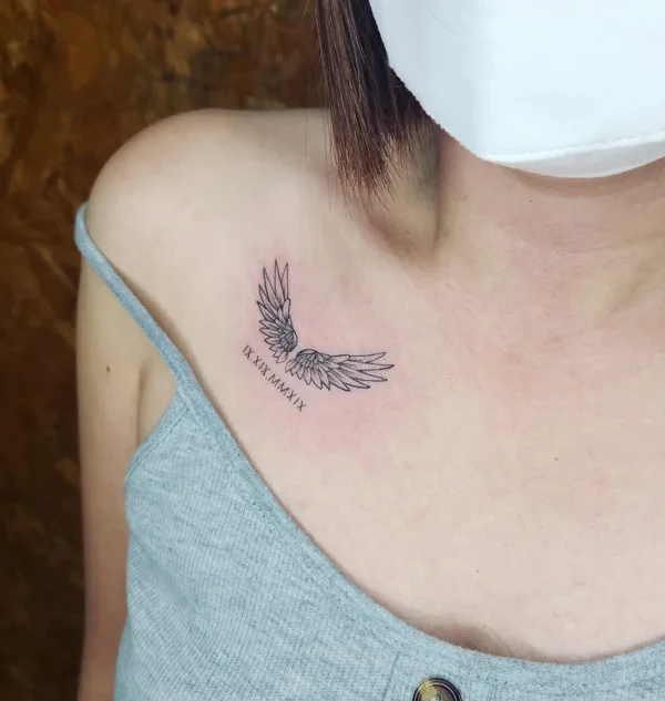 Small angel wings tattoo 1