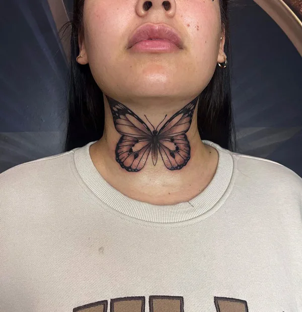 Butterfly front neck tattoo