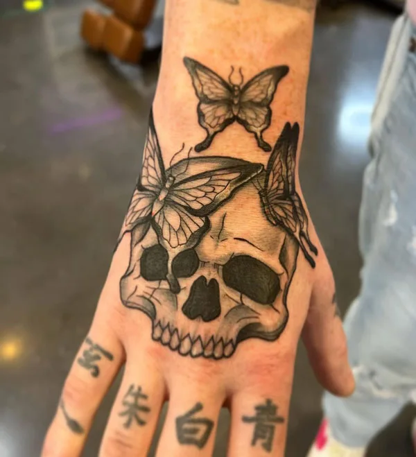 Butterfly Skull Tattoo on Hand 1