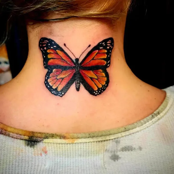 Monarch butterfly neck tattoo