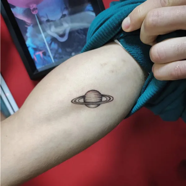 Saturn Bicep Tattoo