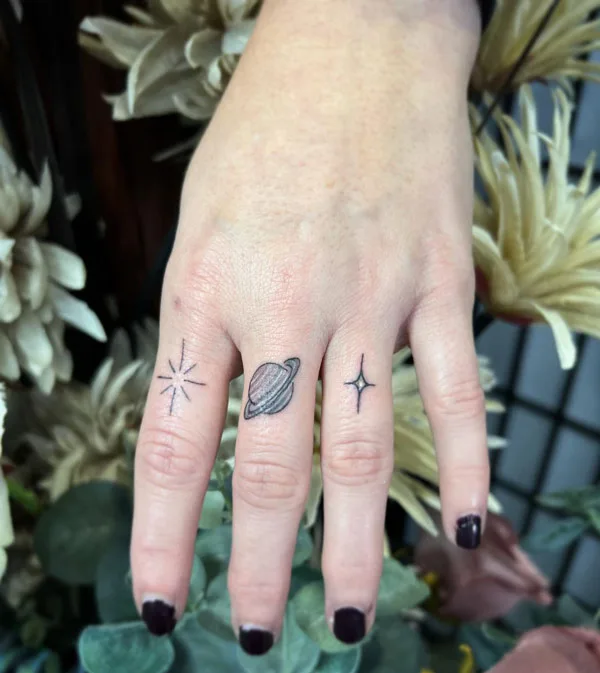 Saturn Finger Tattoo